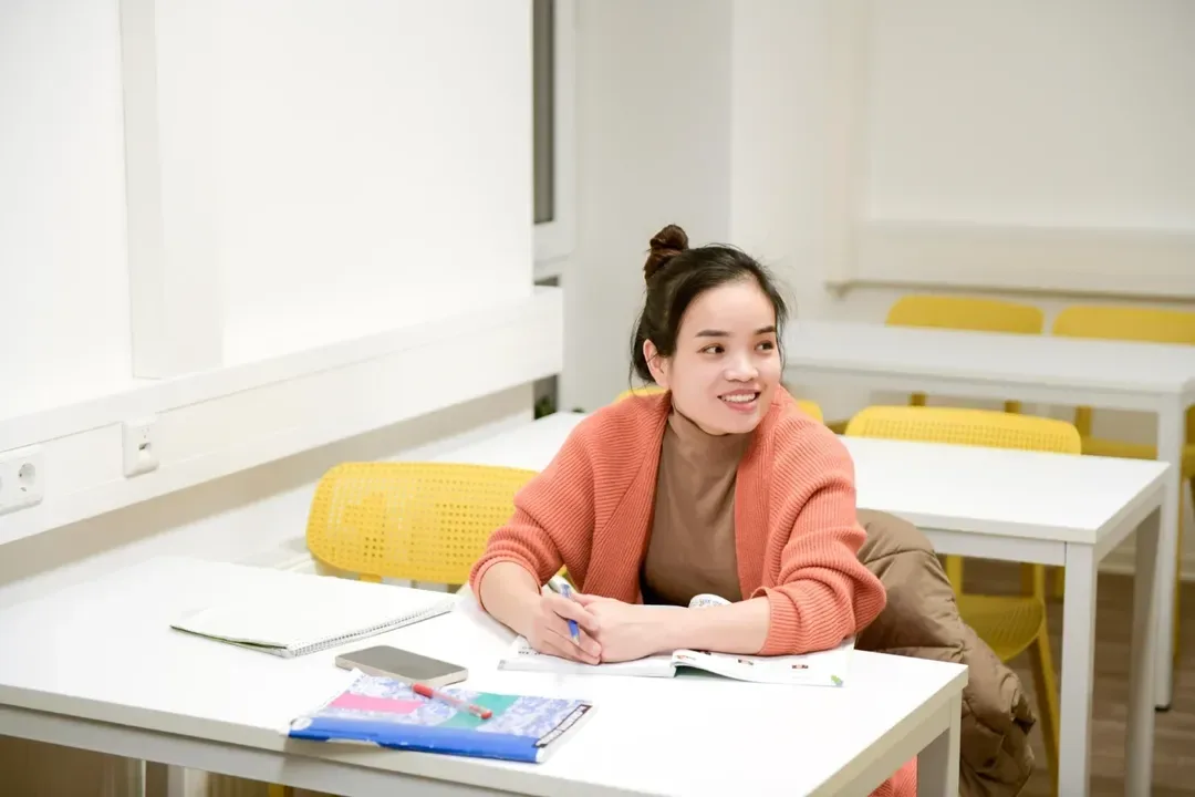 Close-up view of a language tutor explaining grammar to a student